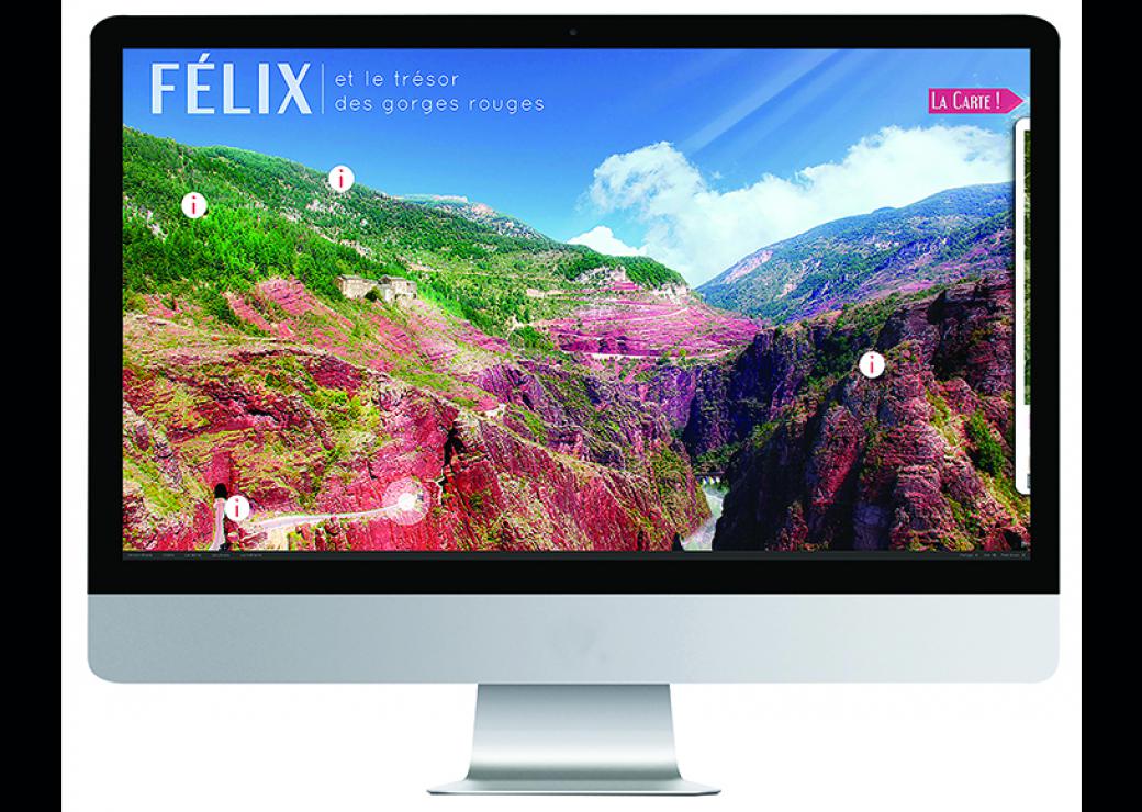 Photo d'un écran d'ordinateur sur lequel est affiché une photo d'un paysage naturel. On peut lire "Félix et le trésor des gorges rouges"